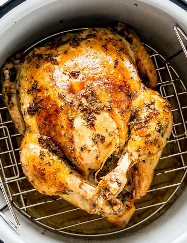 overhead shot of a whole chicken in a pressure cooker