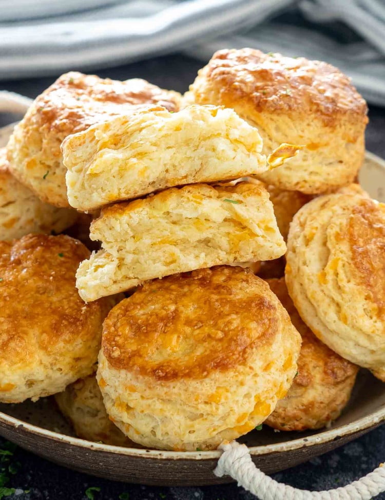 a bunch of cheese biscuits in a bowl.