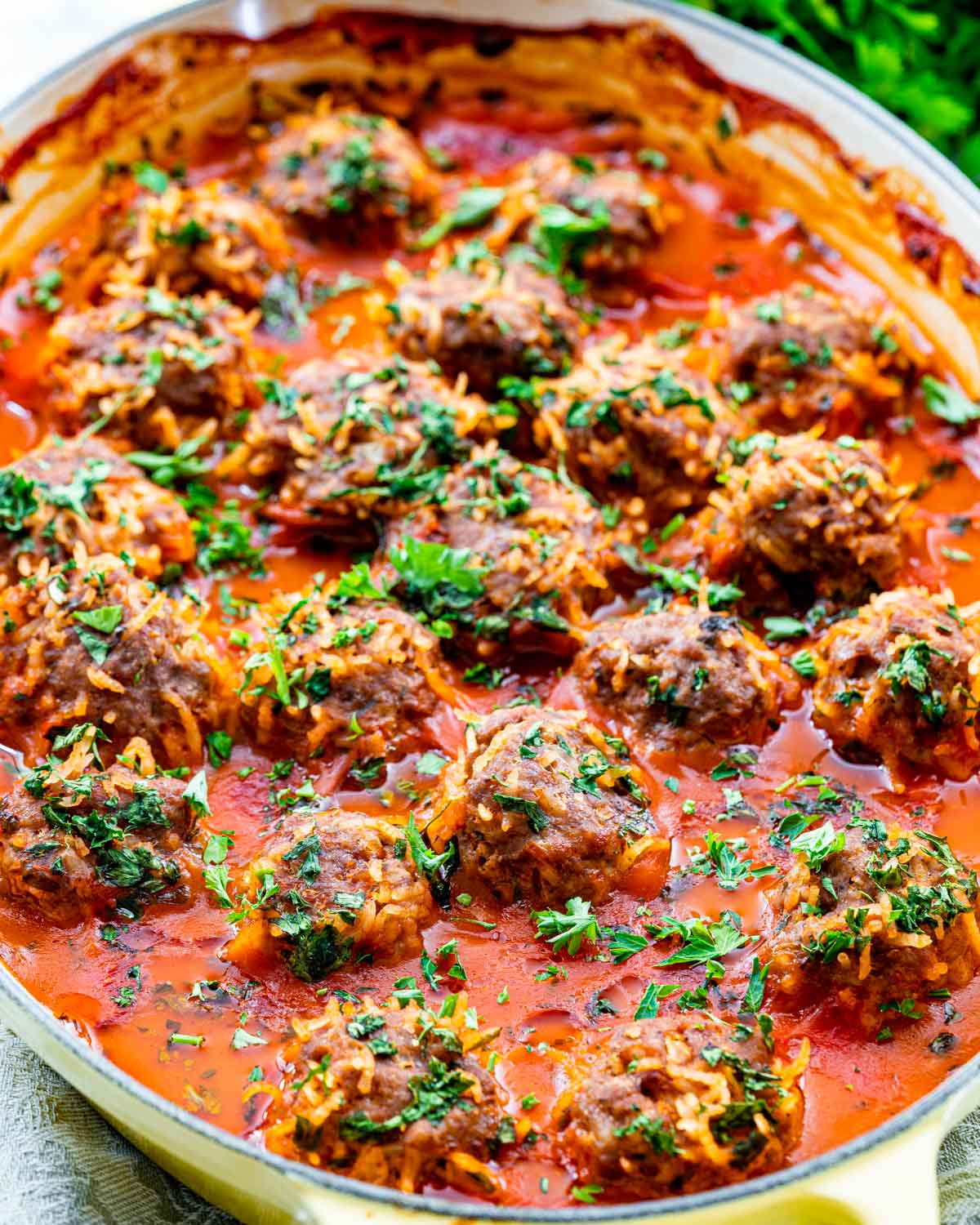 finished porcupine meatballs in a baking dish