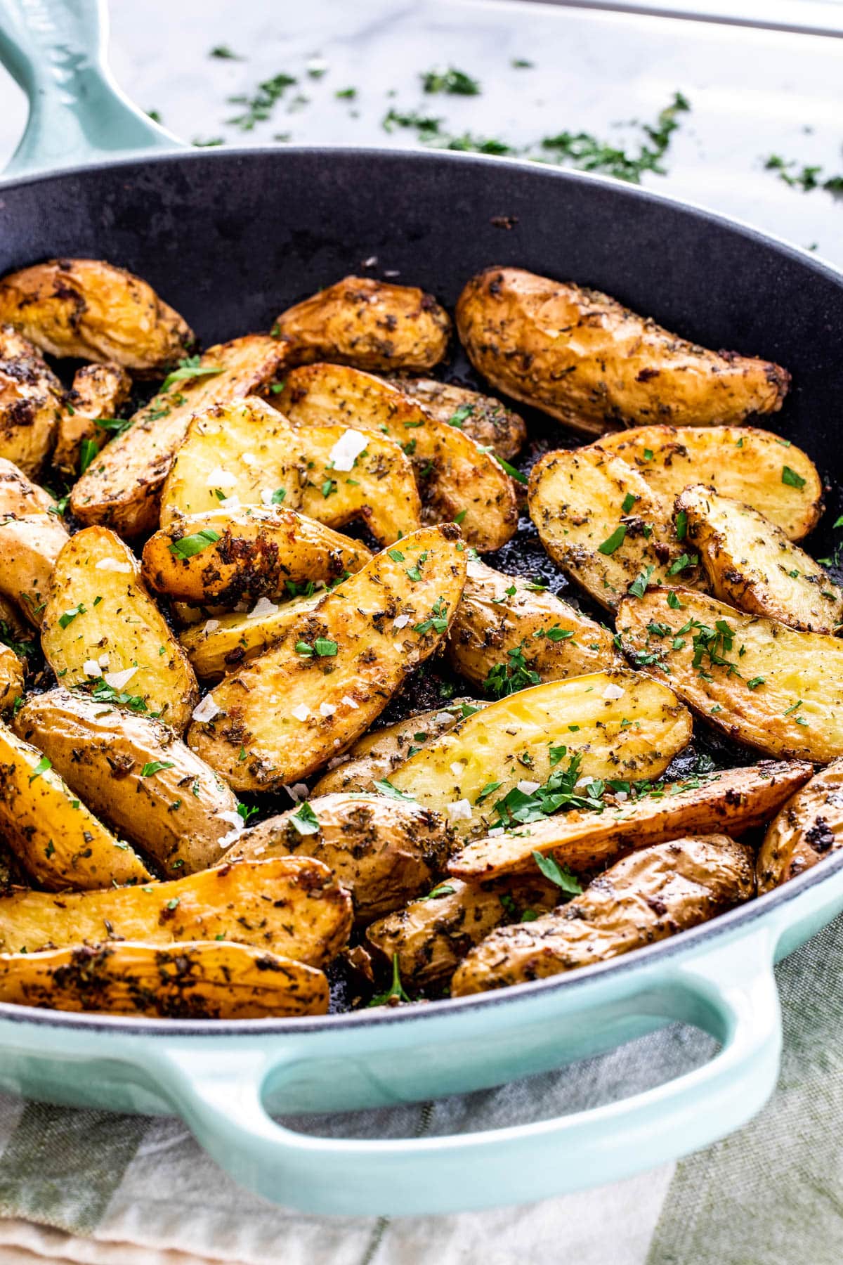 roasted fingerling potatoes in a blue skillet