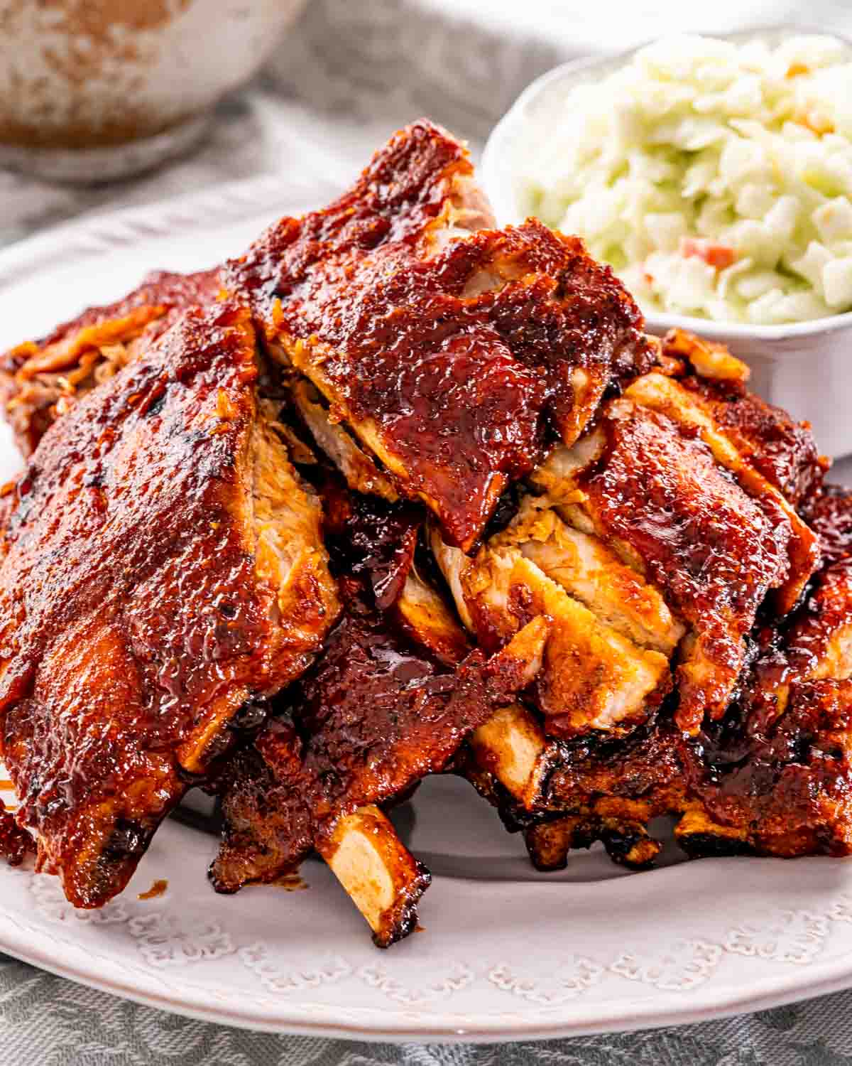bbq ribs on a plate with coleslaw.