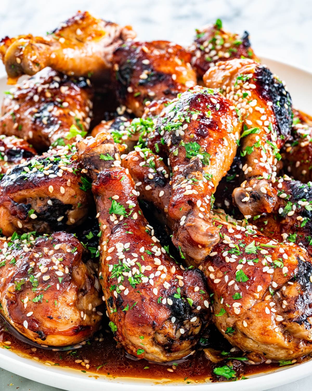 Korean BBQ Chicken on a white plate garnished with parsley