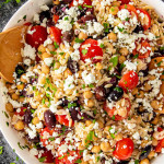 freshly made mediterranean orzo salad in a big white bowl.