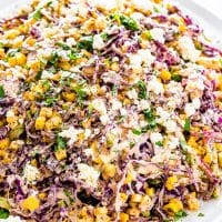 side view shot of Mexican street corn slaw on a large serving plate
