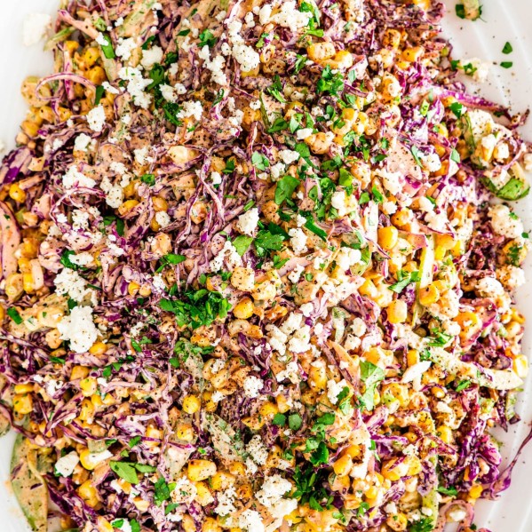 overhead shot of mexican street corn slaw on a large serving plate