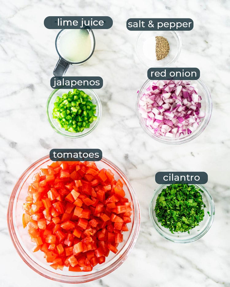 overhead shot of all ingredients needed to make pico de gallo