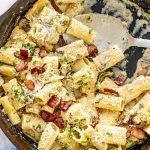 freshly made bacon leek pasta in a skillet.