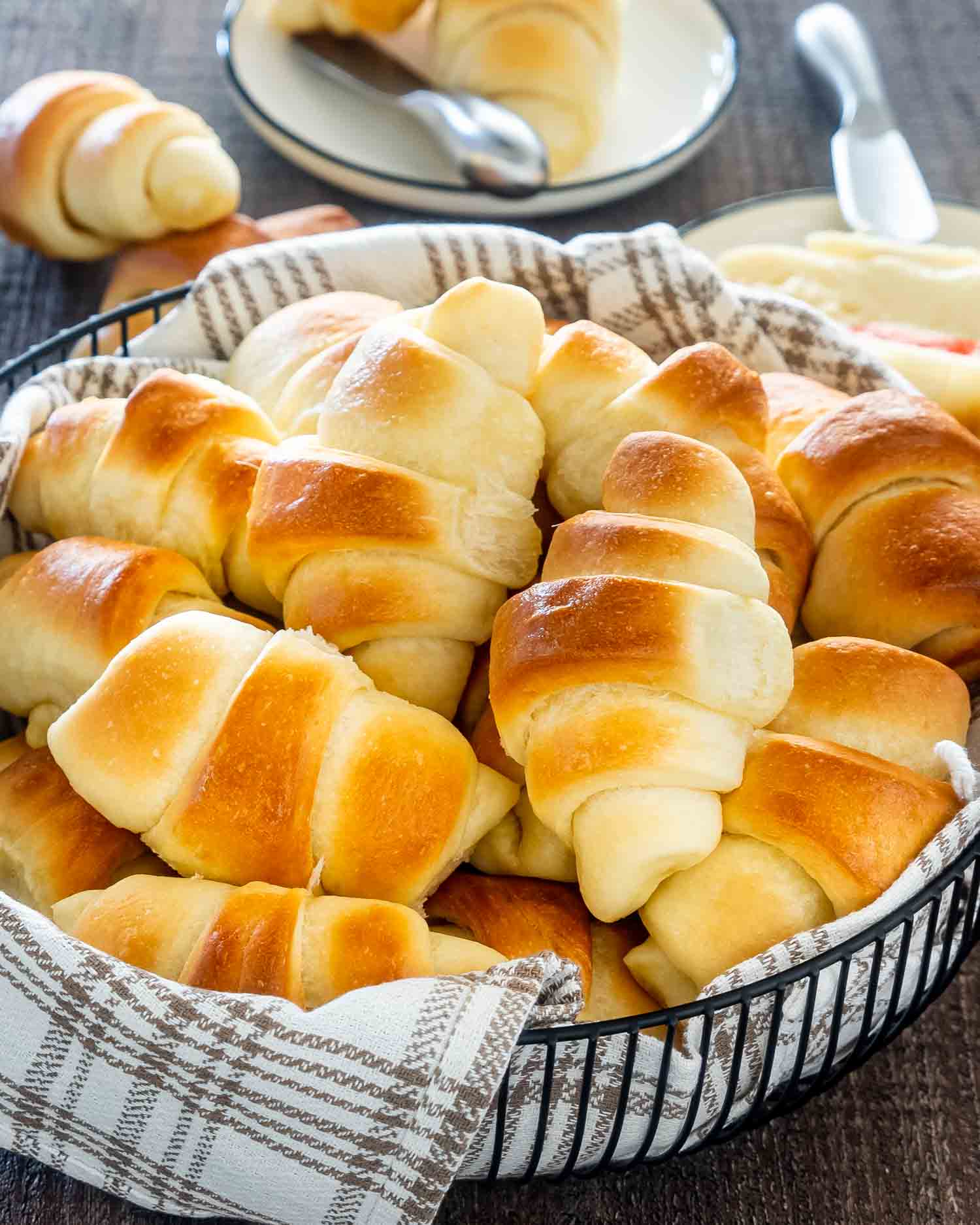 freshly baked crescent rolls in a basket.