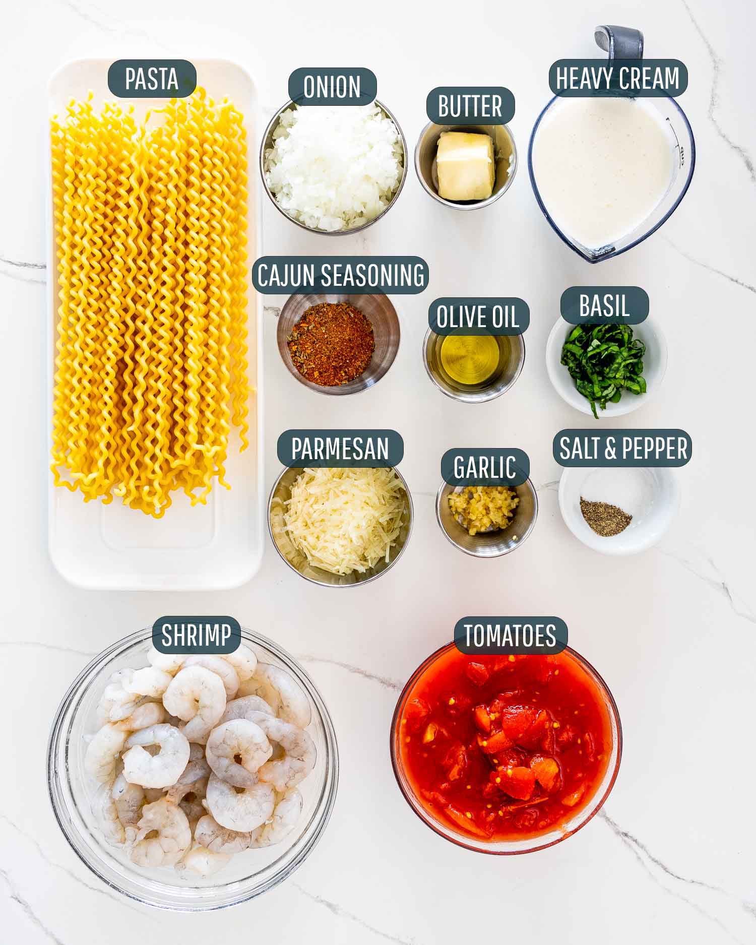ingredients needed to make cajun shrimp with tomato alfredo pasta.