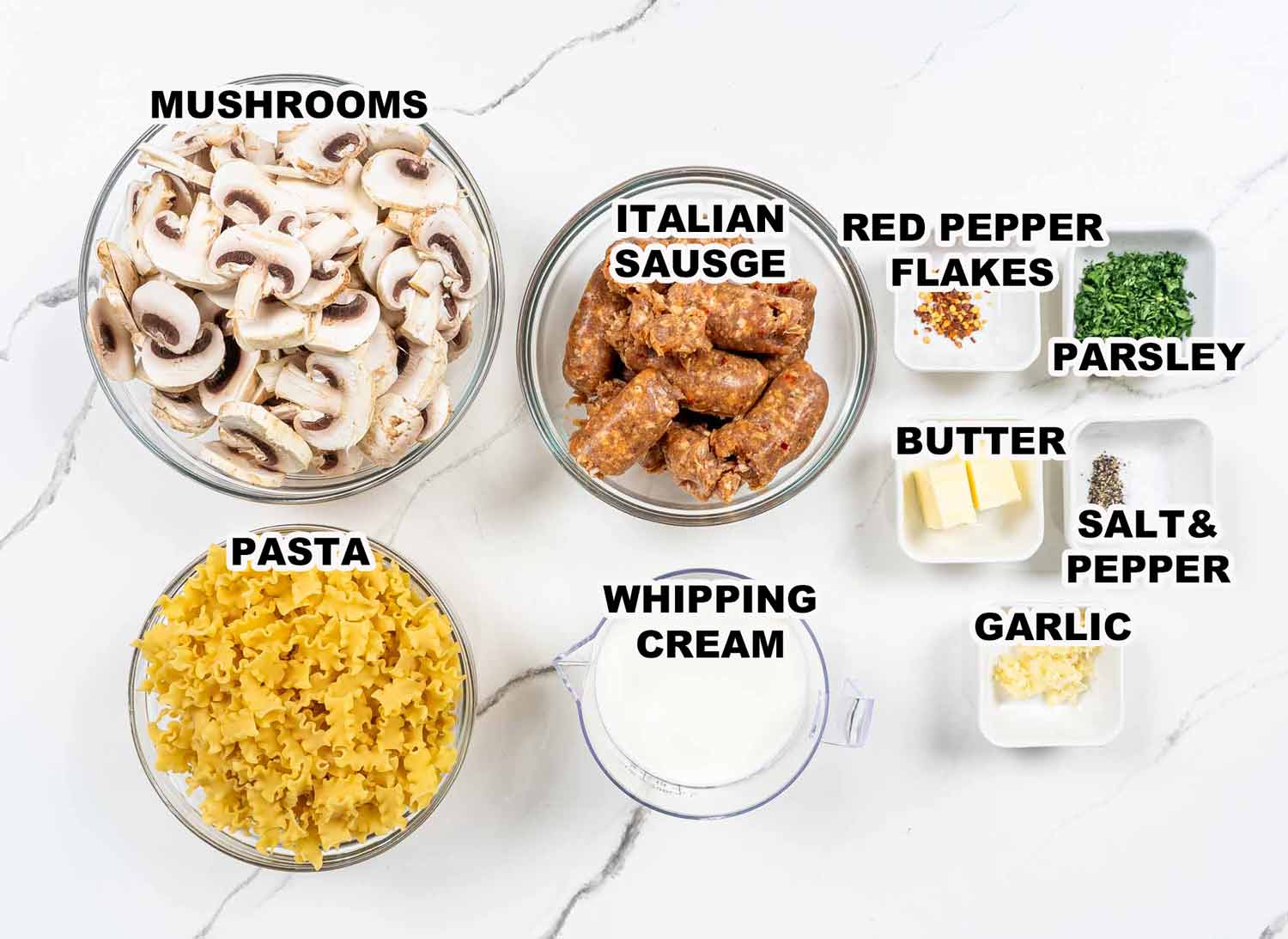 ingredients needed to make creamy sausage mushroom pasta.