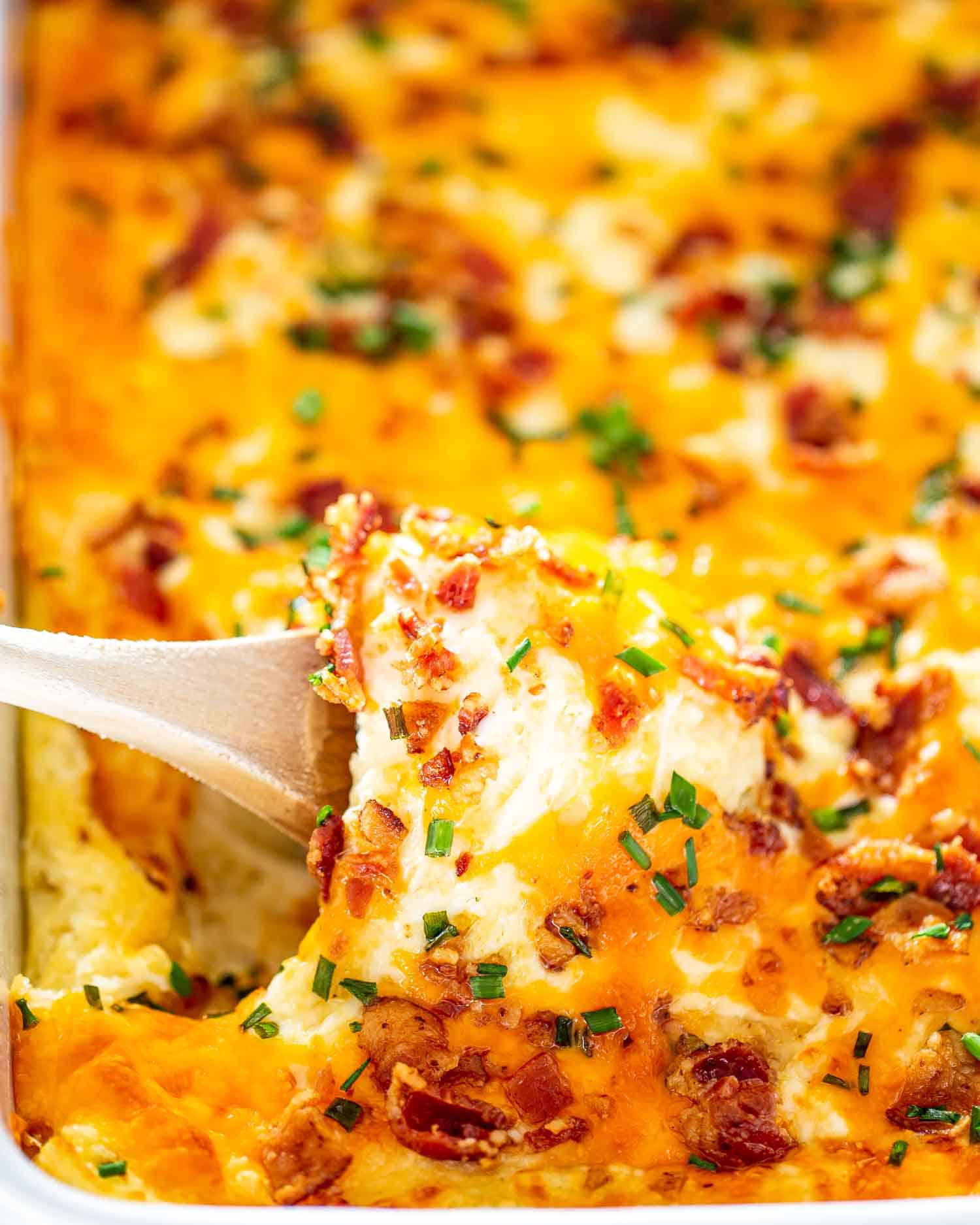 cheesy mashed potatoes in a casserole dish.