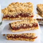a stack of date squares on a plate.