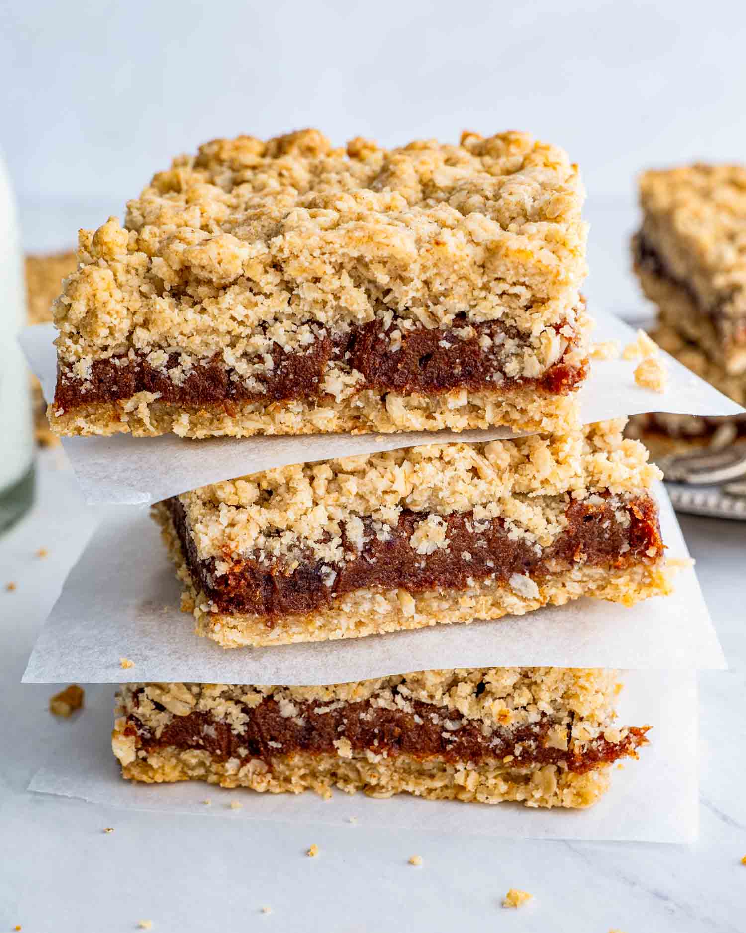 a stack of date squares on a plate.