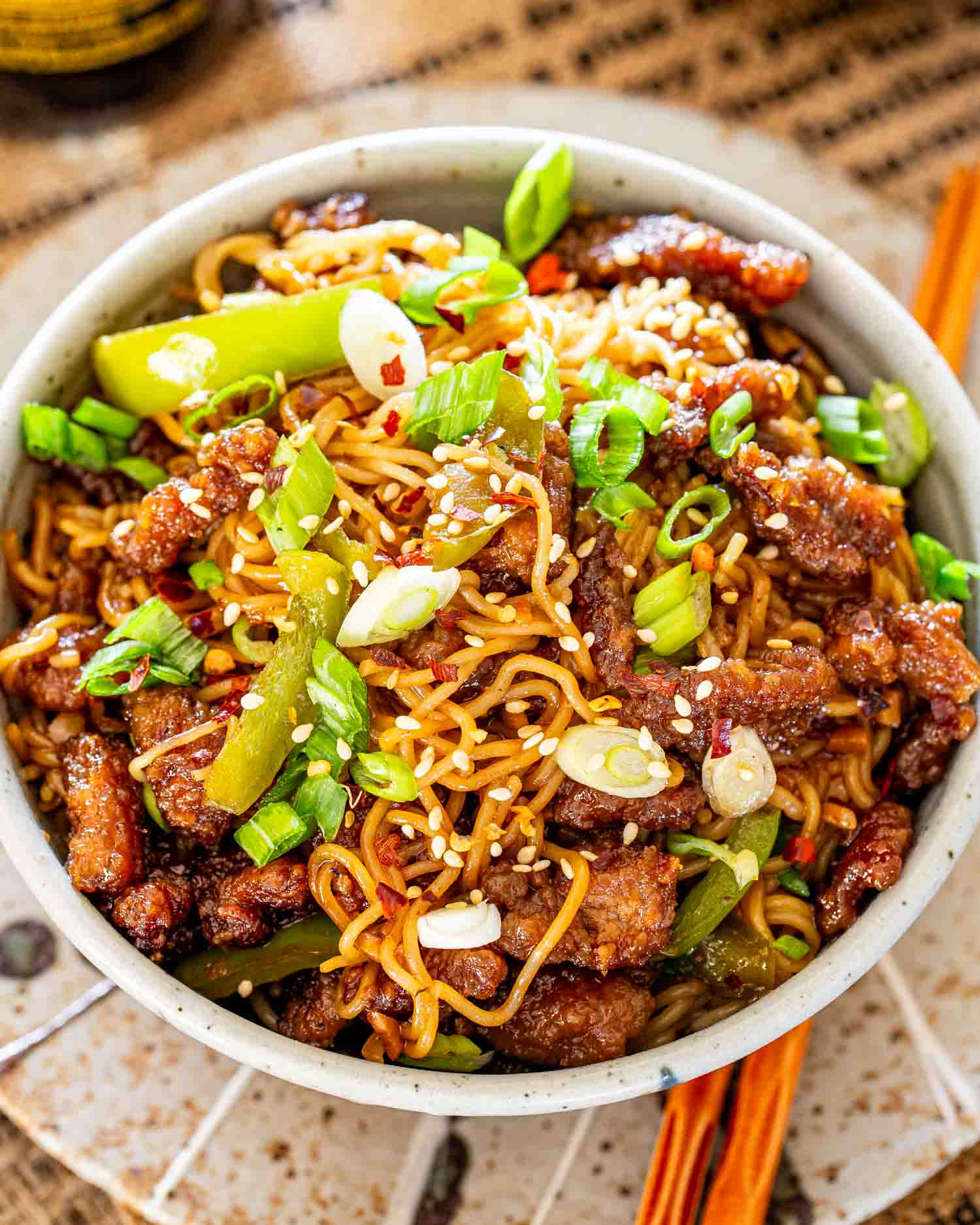 a serving of mongolian beef noodles in a bowl.
