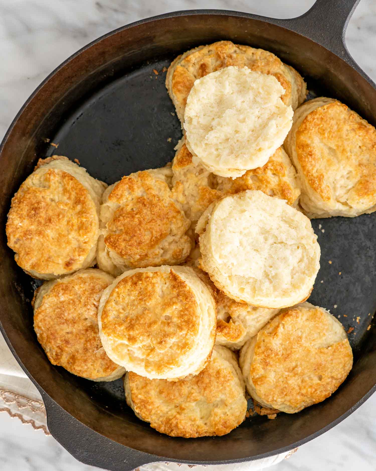 buttermilk biscuits freshly baked in a cast iron skillet.