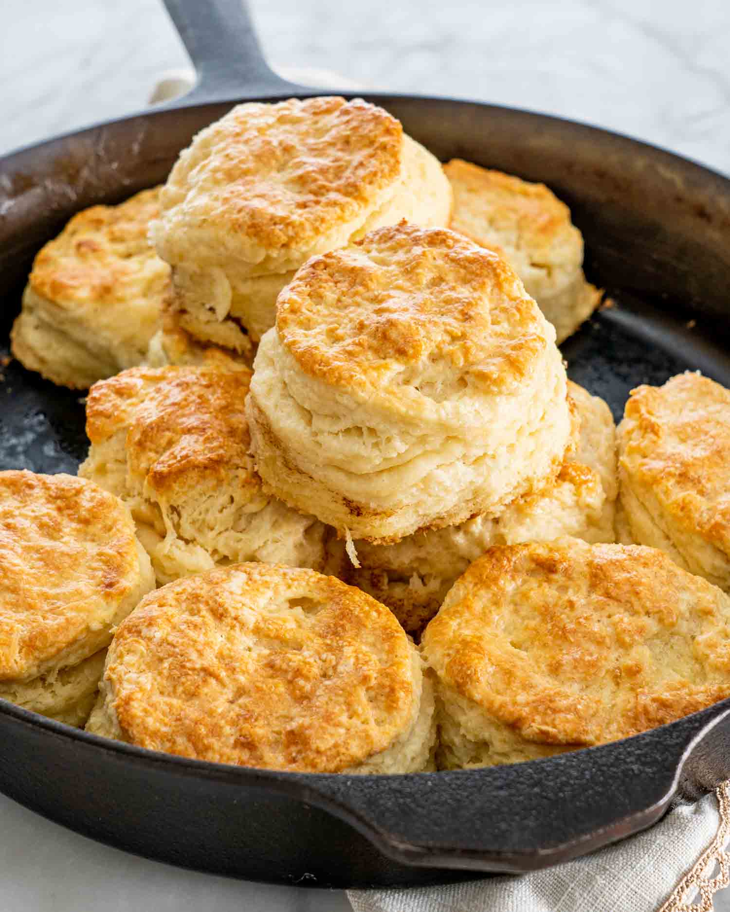 buttermilk biscuits freshly baked in a cast iron skillet.