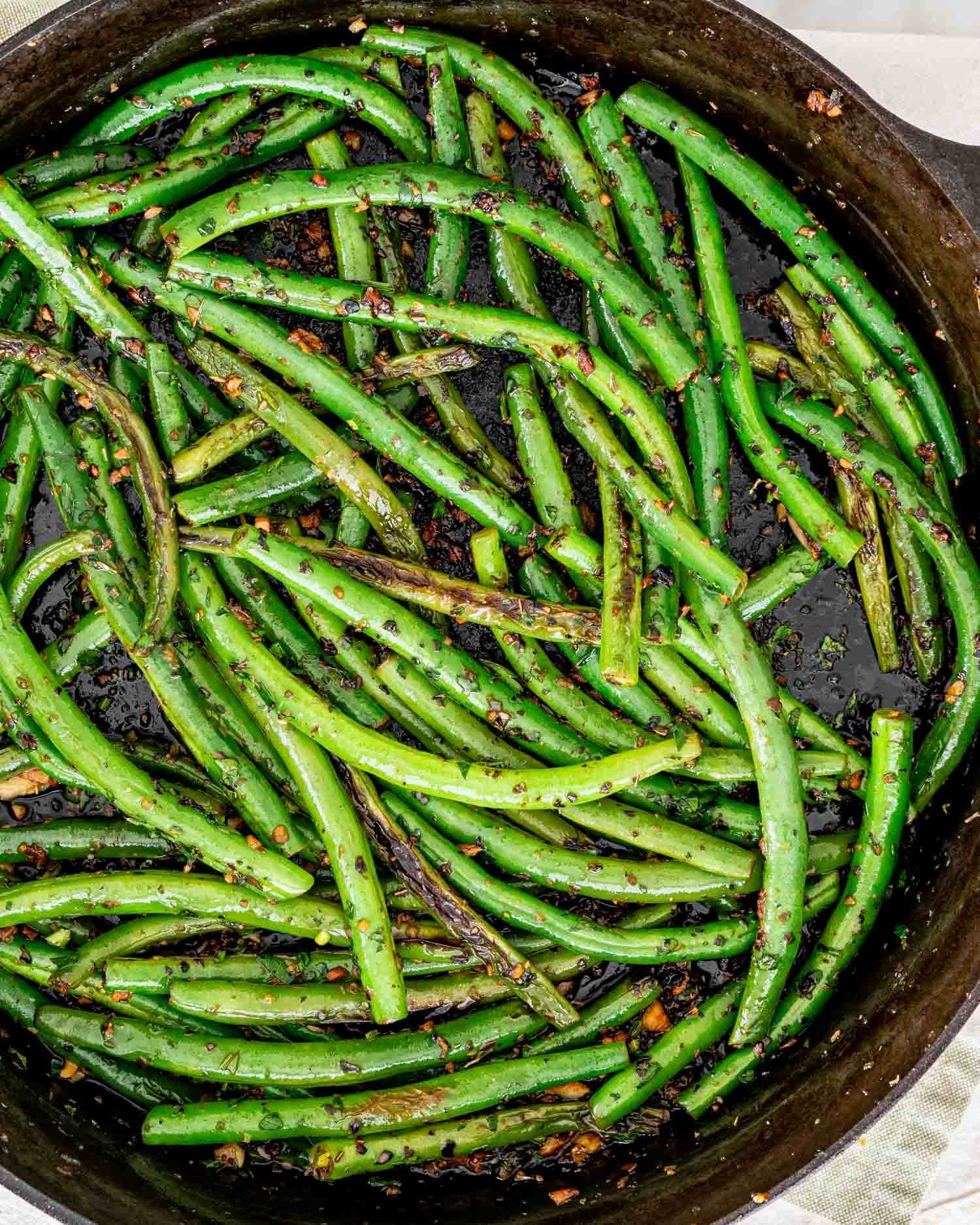 freshly made skillet green beans in a black cast iron skillet.