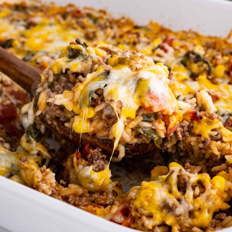 mexican beef and rice casserole in a white casserole dish.