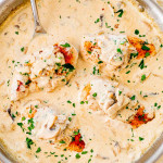 overhead of chicken breasts smothered in creamy mushroom sauce.