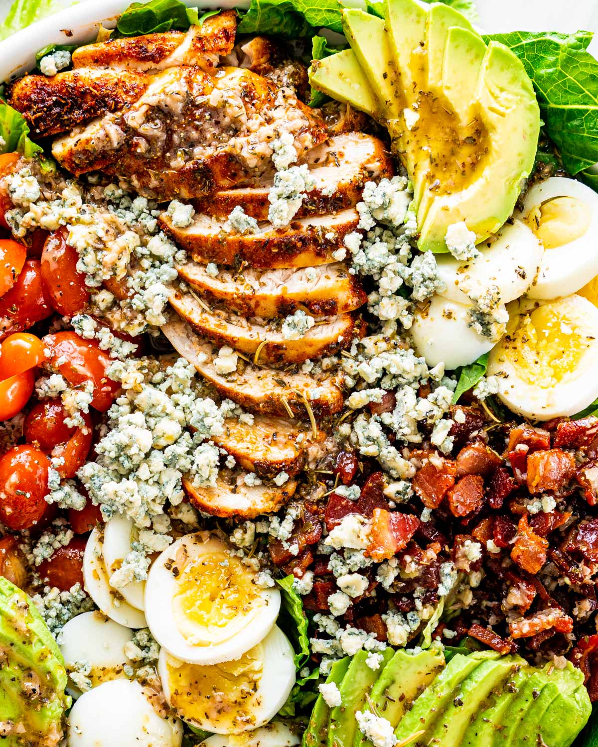 overhead shot of a gorgeous cobb salad on a white platter