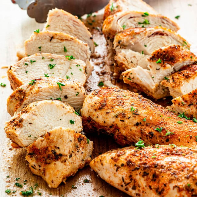 sliced instant pot chicken breasts on a cutting board