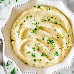 overhead shot of instant pot mashed cauliflower in a decorative serving dish