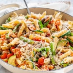 side view shot of a large pan full of pasta primavera.