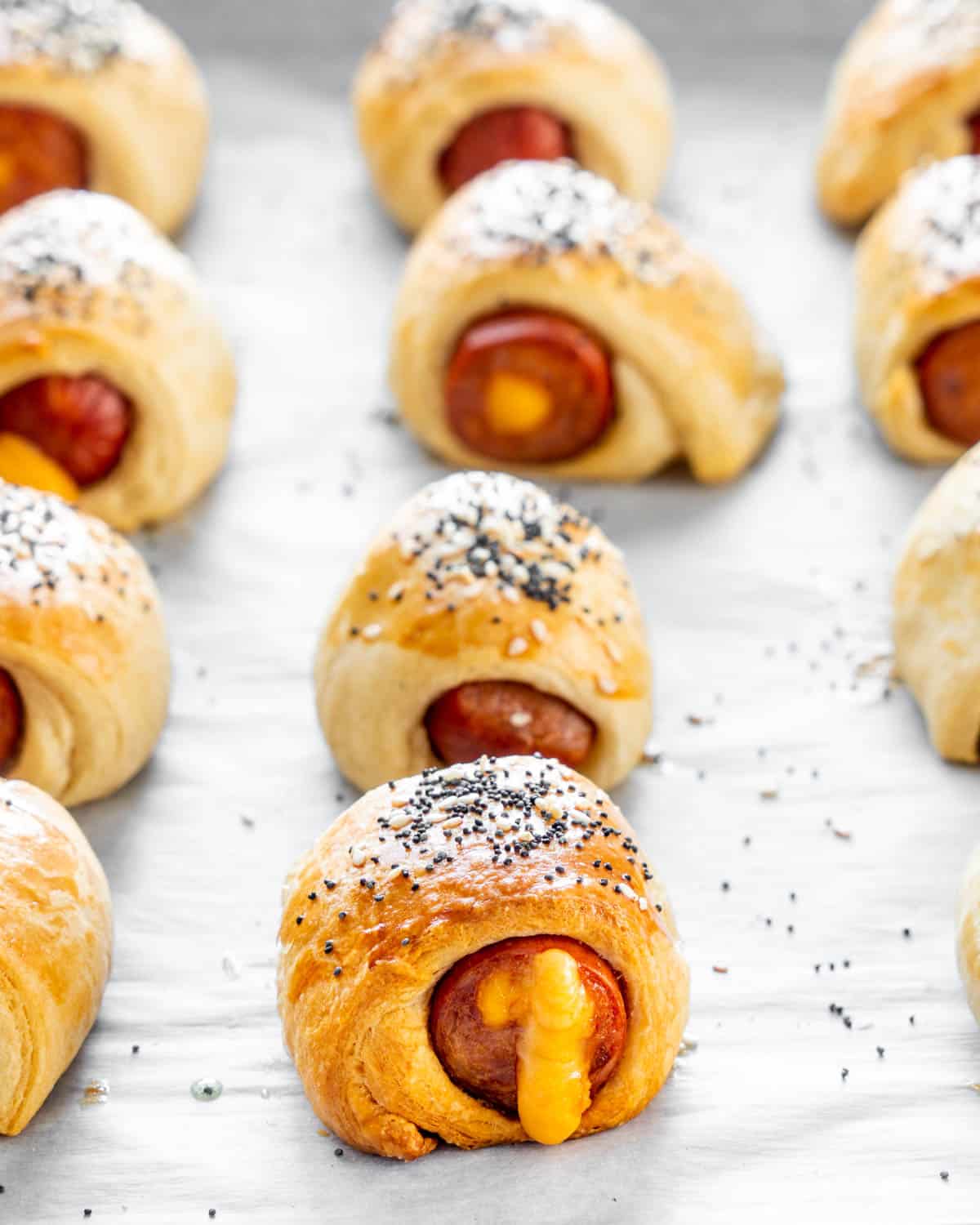 close up of pigs in a blanket on a baking sheet freshly baked