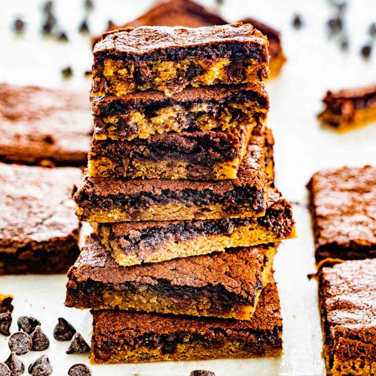 brookies stacked on top of each other surrounded by chocolate chips