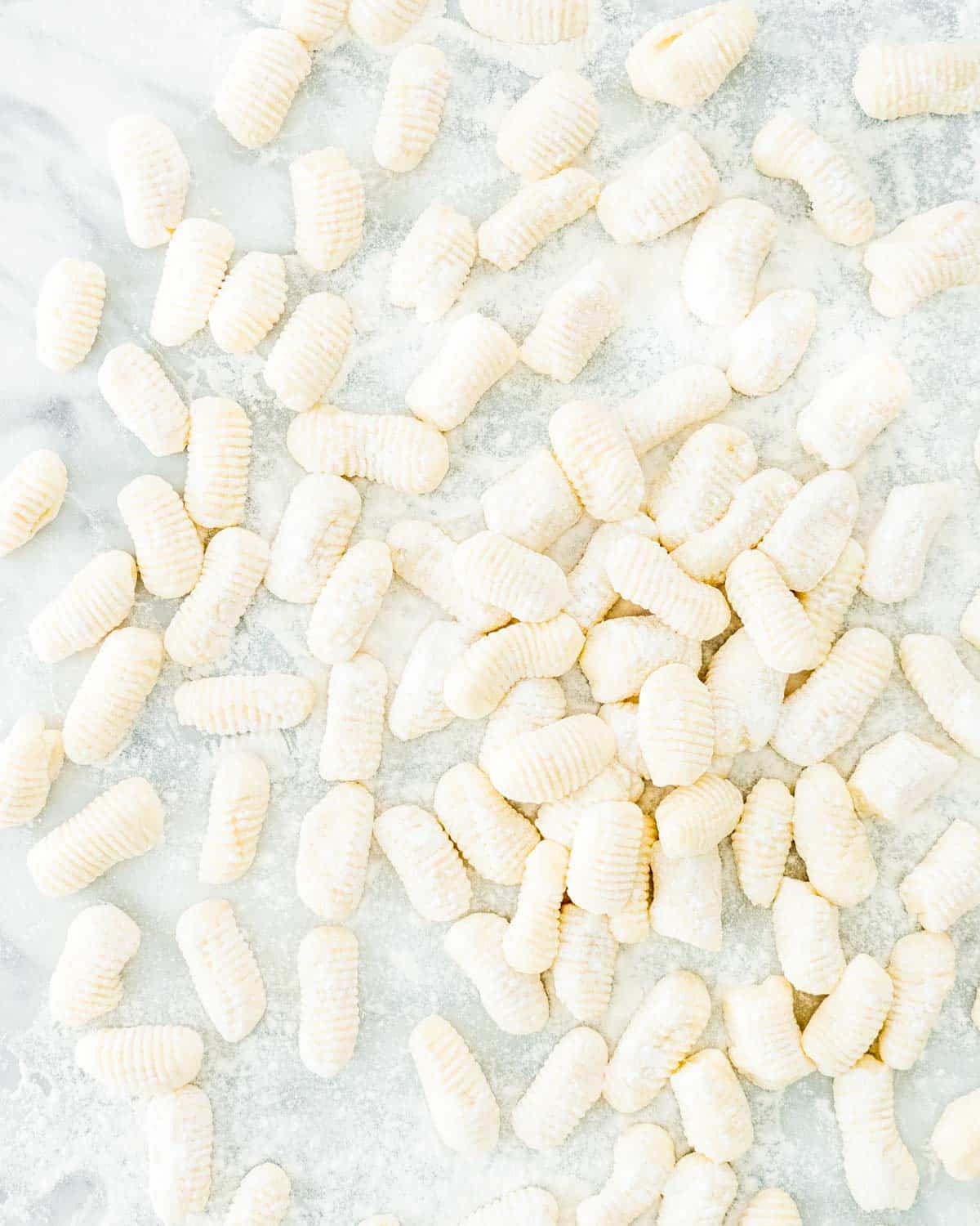 overhead shot of gnocchi freshly made on a floured surface