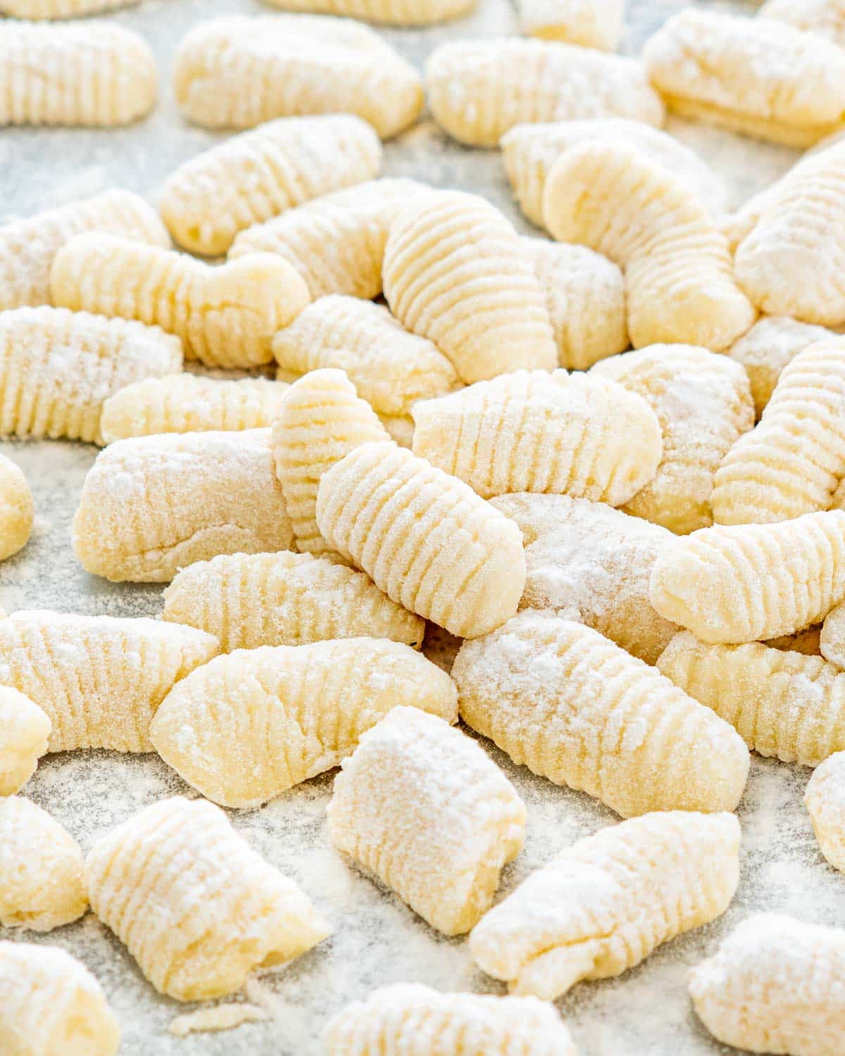 freshly made gnocchi on parchment dusted with flour