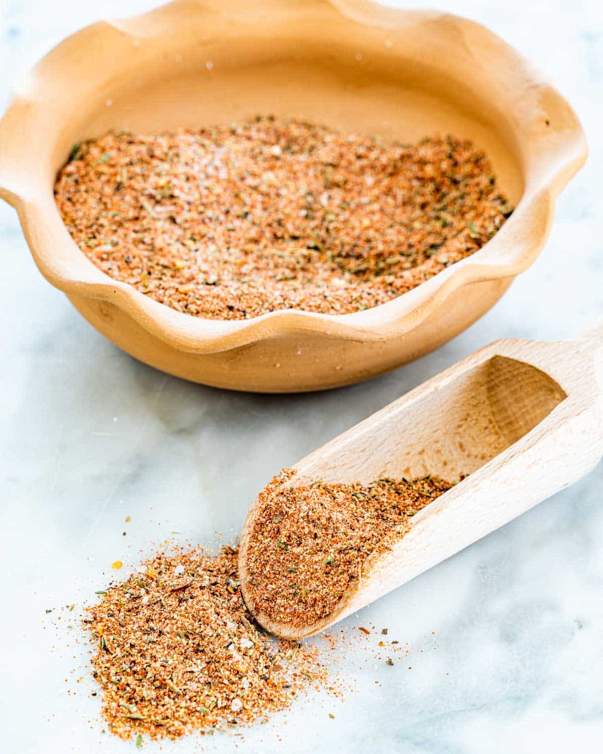 cajun seasoning made from scratch in a bowl with a scoop 