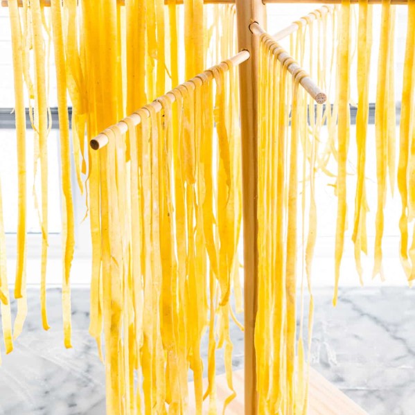 Homemade pasta noodles being dried