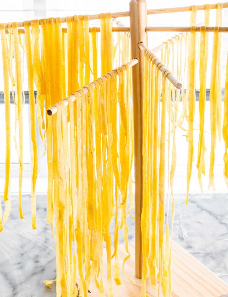 Homemade pasta noodles being dried