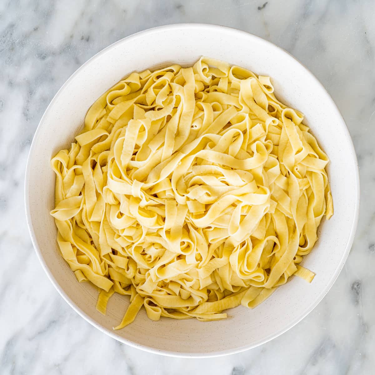 fresh pasta cooked in a white bowl