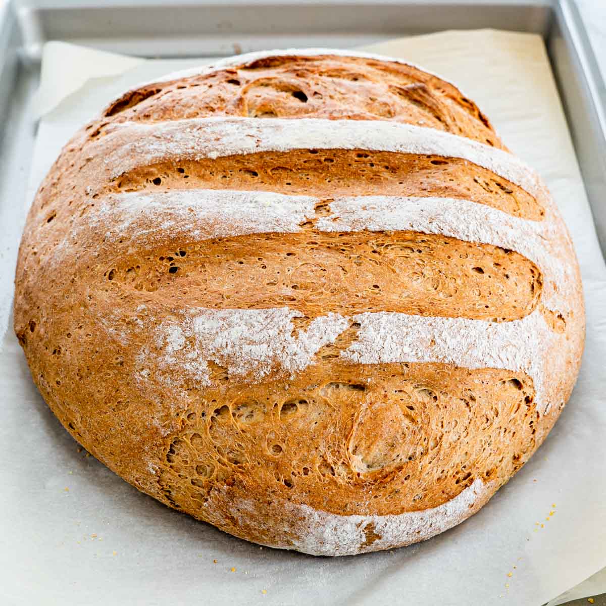a rye bread on a baking sheet fresh out of the oven