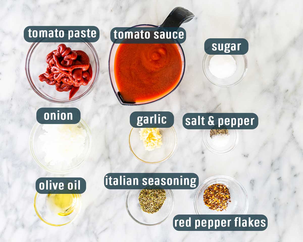 overhead shot of all the ingredients needed to make pizza sauce