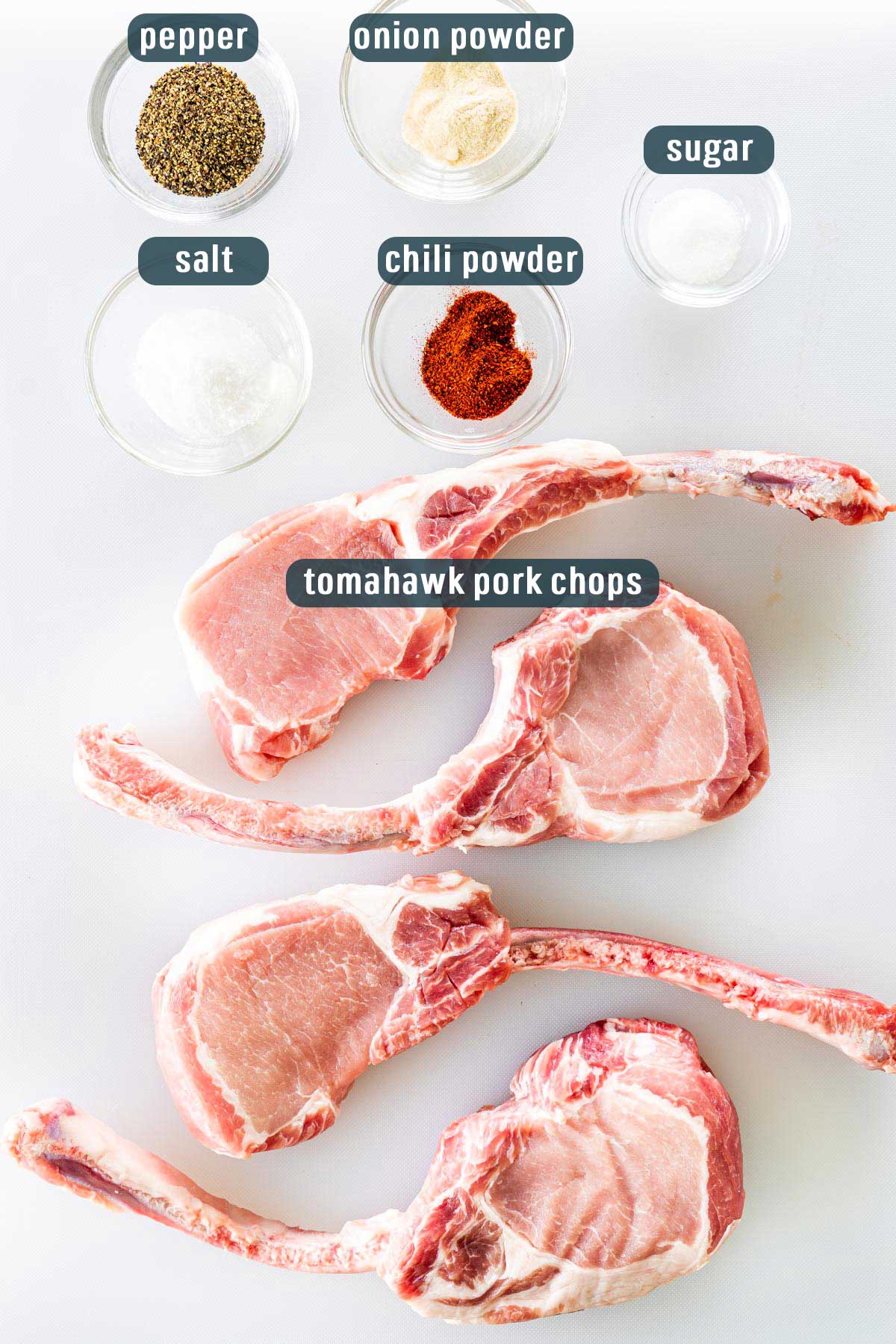 Overhead shot of all the ingredients needed to make grilled tomahawk pork chops