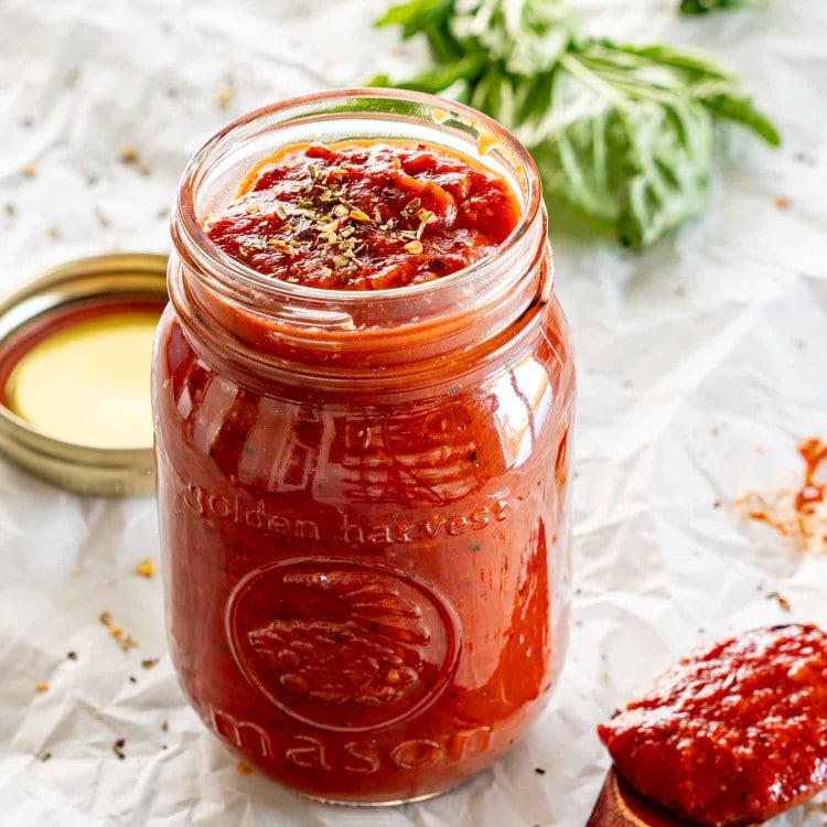 freshly made pizza sauce in a jar.