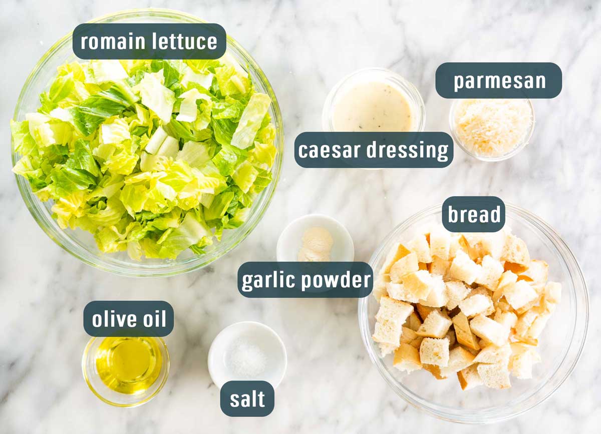 overhead shot of all the ingredients needed to make caesar salad