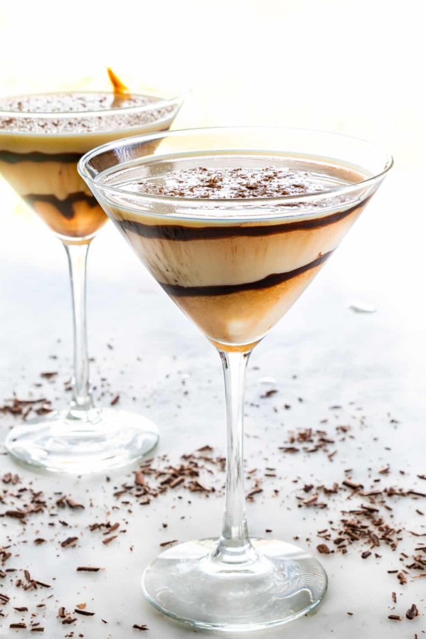 side view shot of 2 martini glasses filled with chocolate martini cocktail