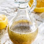 freshly made greek salad dressing in a jar.