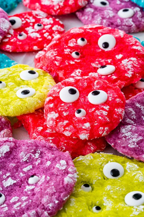 freshly baked monster cookies of all different neon colors with eyeball candy.