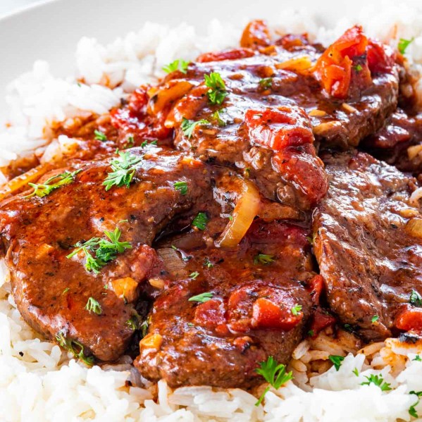 swiss steak over a bed of rice.