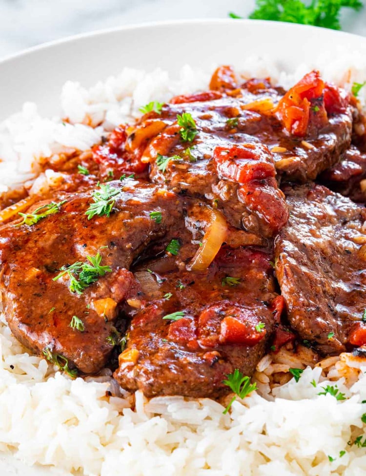swiss steak over a bed of rice.