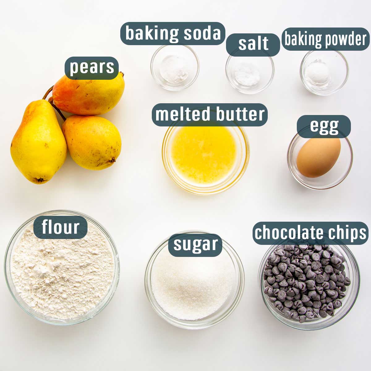 overhead shot of all the ingredients needed to make pear chocolate chip muffins.