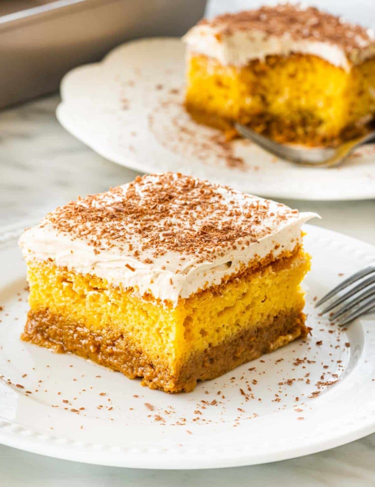 a slice of pumpkin magic cake on a white plate.