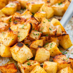 closeup of sweet potatoes on a baking sheet.