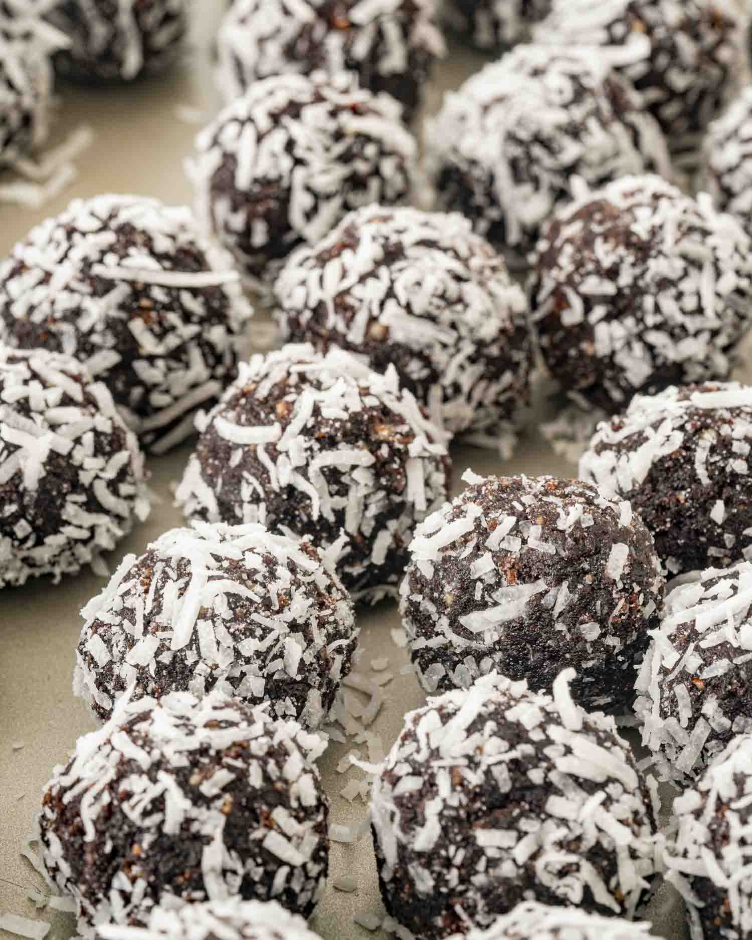 chocolate rumballs on a baking sheet lined with parchment paper.