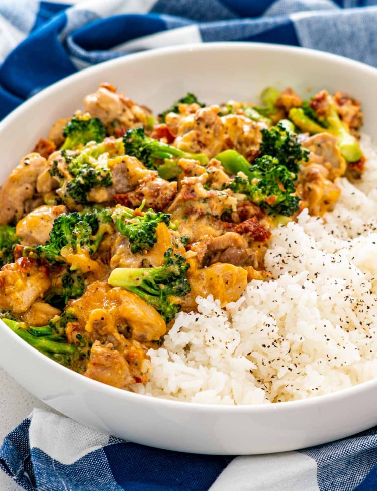 chicken broccoli with rice in a white bowl.